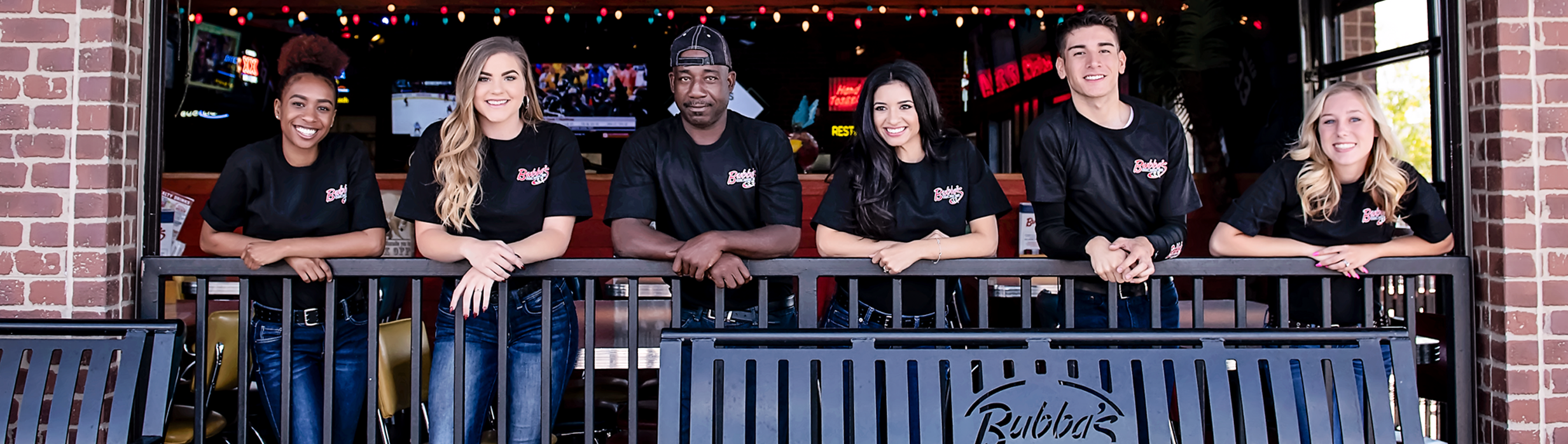 Bubba’s 33 crew members together on the restaurant patio